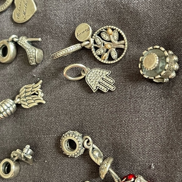 Lot of 26 Authentic Pandora charms.